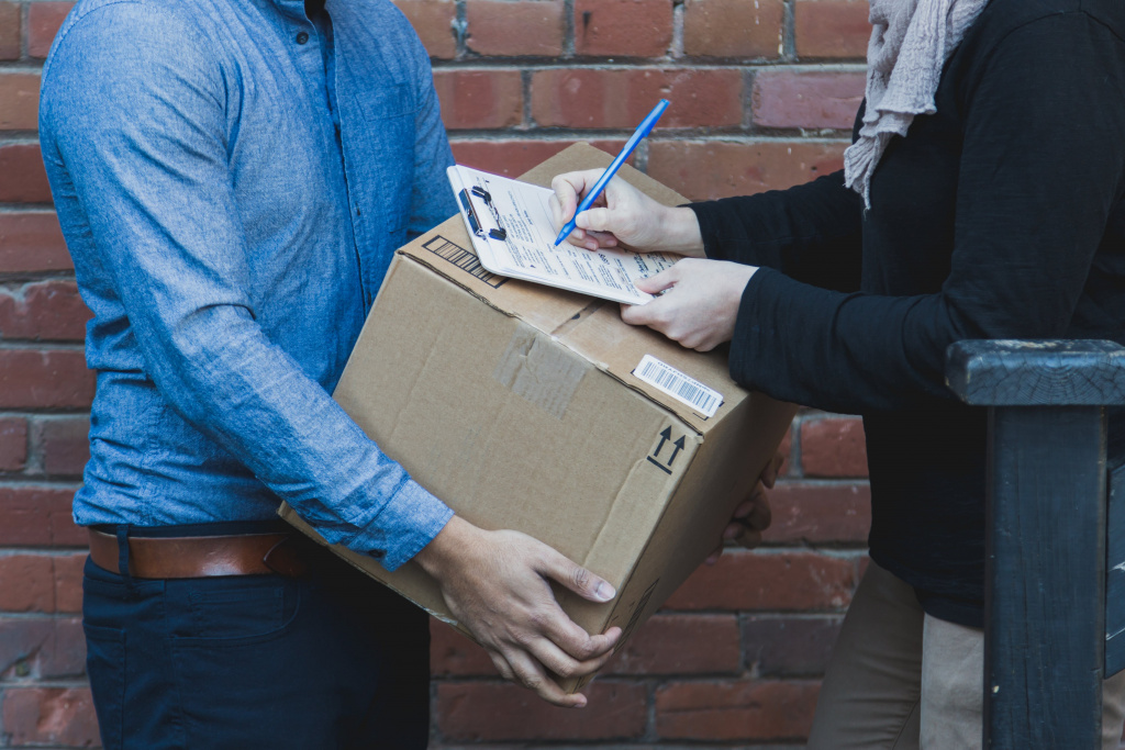 man-signing-for-shipping-box.jpg